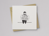 Square white greeting card featuring a simple black line drawing of a person sitting and holding a sign with the handwritten message "You are doing a great job being a person in this world," paired with a brown kraft envelope.
