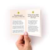 What to Write in Any Card Zine showing interior pages with handwritten tips for card messages, held by a hand against white background. Pages numbered 3 and 4 contain advice about acknowledging life events and expressing admiration for the recipient.