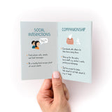 How to Support Someone Zine showing open pages with illustrated tips for social interactions and companionship, featuring advice on communication and support. Mint-colored pages display handwritten text and simple drawings against a white background.