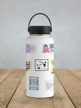 White water bottle with a black lid and handle, decorated with various colorful and black-and-white stickers featuring motivational quotes, illustrations of people, and playful designs.