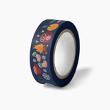 Cozy Winter Washi Tape featuring navy blue decorative tape with colorful winter-themed illustrations including oranges, hot chocolate mugs, warm socks, snowflakes, and stars on a white core. Perfect for seasonal crafting and journaling.