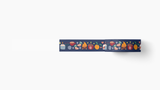 Cozy Winter Washi Tape featuring charming navy blue decorative tape with whimsical illustrations of hot chocolate mugs, oranges, warm socks, cozy fires, and twinkling stars in orange and purple hues, perfect for winter-themed crafting and journaling
