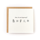Folded wedding card with black illustrations of cake, rings, flowers, clinking glasses, and disco ball on white background