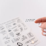 Photo of a hand holding a cute clear sticker.  The sticker has a motivational mental health message that says, Go For A Run Or A Walk.
