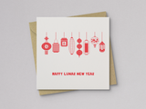 Square greeting card with a simple design of eight red, hand-drawn Asian lanterns hanging in a row above the text "Happy Lunar New Year," paired with a brown kraft envelope.