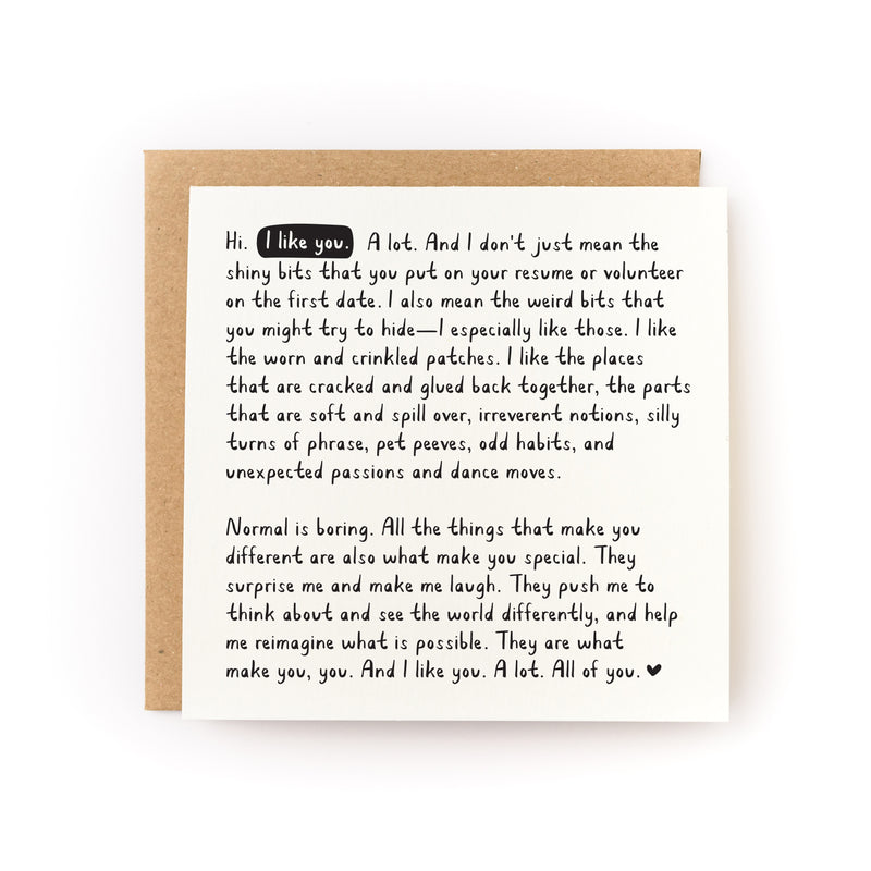 Square letterpress greeting card "I Like You. A Lot. All of You." featuring heartfelt handwritten-style black text on white paper, paired with kraft envelope. Card celebrates authenticity and uniqueness with a long, intimate message about appreciating someone's quirks and imperfections.