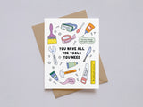 Encouragement card with colorful tool illustrations and motivational messages reminding you have all you need inside a brown envelope