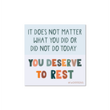 You Deserve To Rest Sticker featuring colorful text on white background reading It does not matter what you did or did not do today, You deserve to rest in playful mixed typography. Square vinyl sticker by Kwohtations with motivational self-care message.