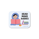 Sticker featuring a person reading a book with stacked books and cup beside them with the text read more books
