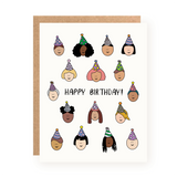 Birthday card with cheerful illustrated faces wearing party hats surrounding handwritten Happy Birthday text on white background