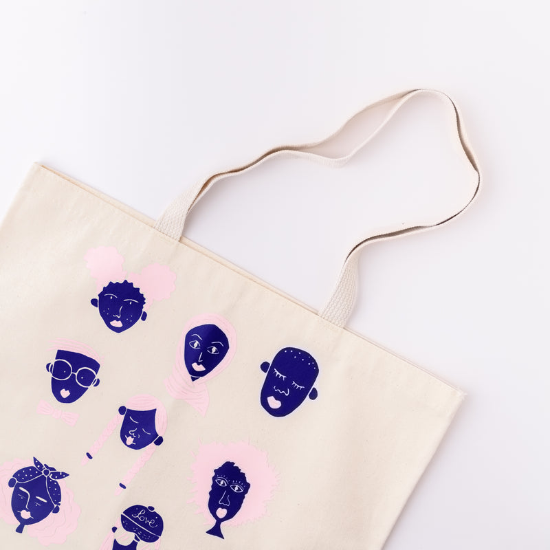 Flat lay of canvas We Give Me Hope screenprinted cotton tote