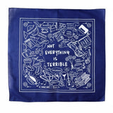 Flat lay of Not Everything is Terrible screen printed bandana featuring hand drawn illustrations including coffee, flowers, dumplings, and an airplane.