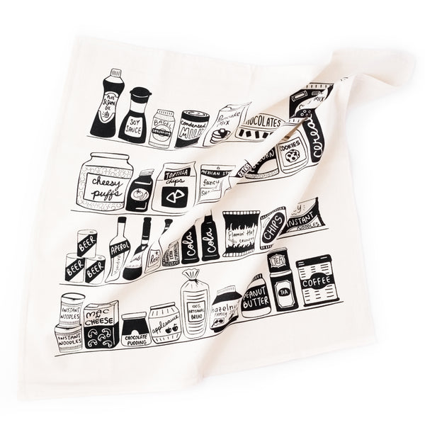Cute dish towel with illustrations of food pantry items. 20" x 20" cotton flour sack tea towel with black screen printed illustrations, including must have pantry items like soy sauce, cola, peanut butter, and coffee.