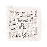 Funny dish towel with illustrations of common baking measurements and baking questions. 28" x 29" cotton flour sack tea towel with black screen printed illustrations, including what is a pastry brush, how many tablespoons are in a cup, and is baking soda the same as baking powder. 