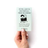 Hand holding small mint book to how to care for your introvert that has two people reading and says "Do feel lucky to have them as a friend or a partner"