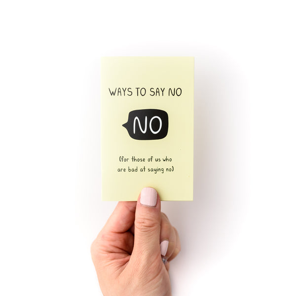 Hand holding small yellow booklet, which is a fun self help guide on how to say no and set boundaries, titled "Ways to say no (for those of us who are bad at saying no)"